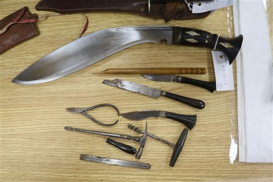 A Kukri with accessories to scabbard and a Burmese dagger